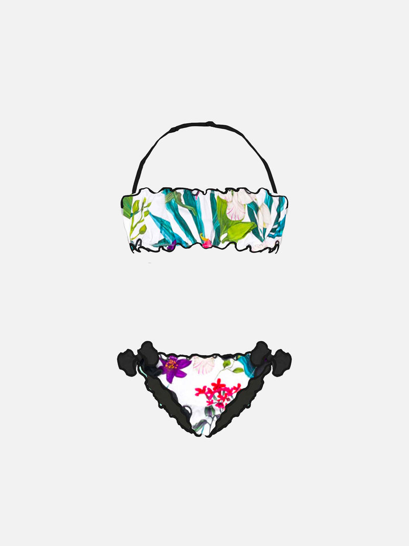 Girl bandeau bikini with tropical leaves